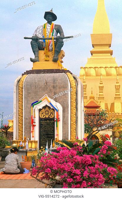 Laos Vientiane Buddha religion woman praying That Luang Temple - 01/01/2016