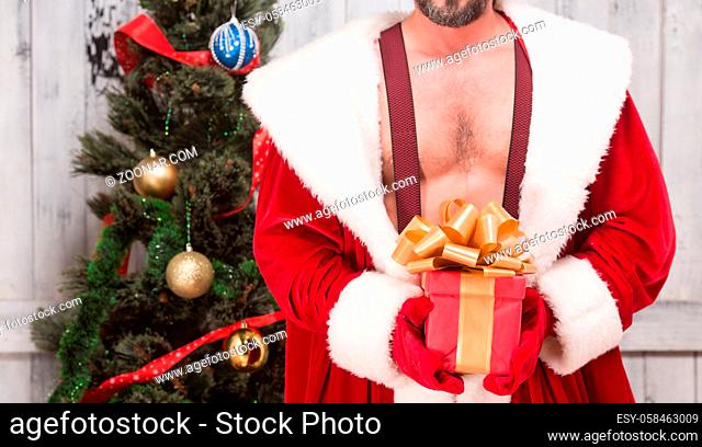 Bad Santa Clause with New Year gift is nice present for any girl or woman for New Year or Christmas. New Year celebration or holiday concept