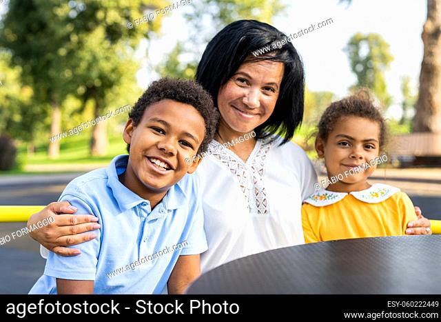 Beautiful happy african american family bonding at the park - Black family having fun outdoors, proud grandma with her grandchild