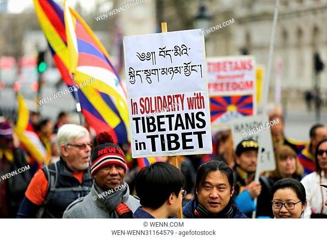 Tibetans and supporters of Tibet take part in a demonstration outside Downing Street in Whitehall, London, and march to the Chinese Embassy in London to mark...
