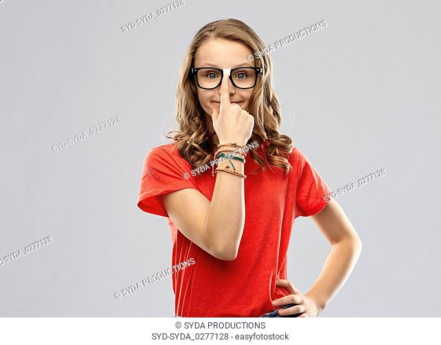 smiling student girl in glasses and red t-shirt