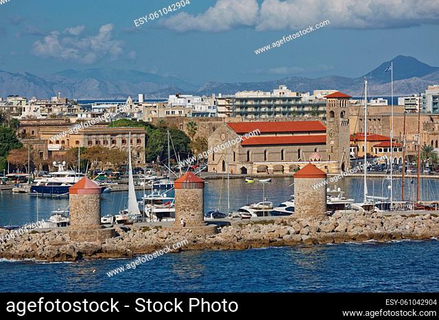 RHODES, GREECE - OCTOBER 26, 2017: Marine Gate and the fortifications of the Old Town of Rhodes, view from Mandraki harbour, Rhodes, Greece