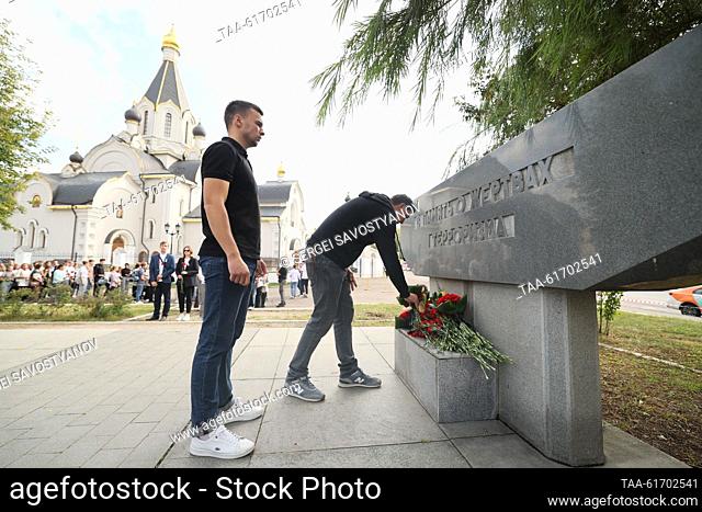 RUSSIA, MOSCOW - SEPTEMBER 3, 2023: People lay flowers during a memorial event for the victims of terrorist attacks in front of Dubrovka Theatre Centre as...