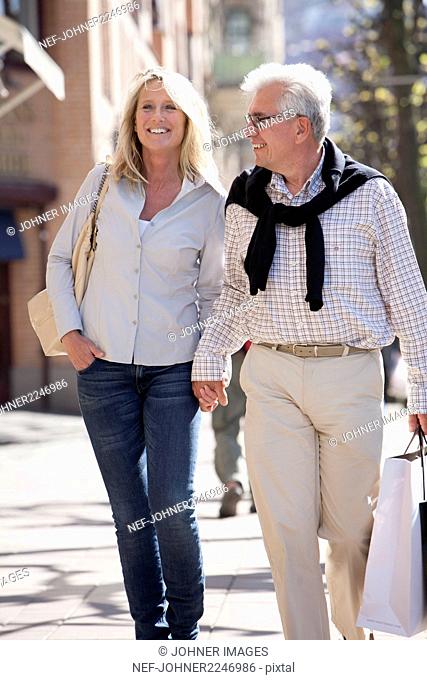 Mature couple walking on street