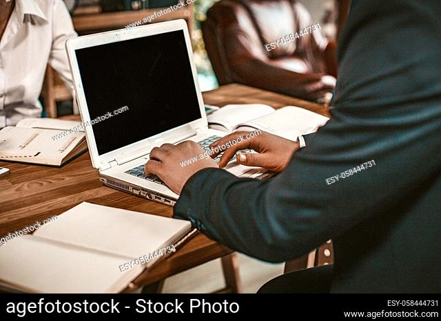Businessman Working With Laptop At Office Desk, Close-Up Of Caucasian Males Hands Using Laptop While Sitting At Table During Business Meeting, Toned Image