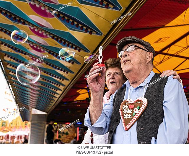 Senior couple having fun together on fair