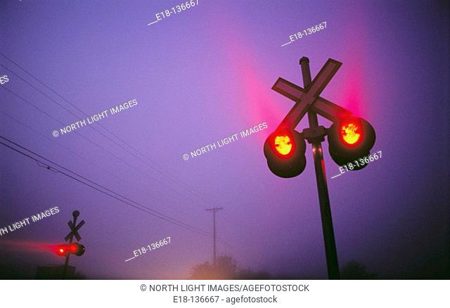 Railway crossing signals on foggy morning in Ladner. Vancouver, British Columbia, Canada