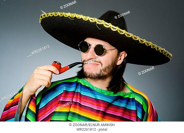 Mexican smoking pipe wearing sombrero