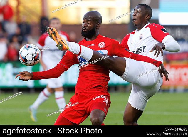 Kortrijk's Didier Lamkel Ze and Antwerp's William Pacho Tenorio fight for the ball during a soccer match between KV Kortrijk and Royal Antwerp FC