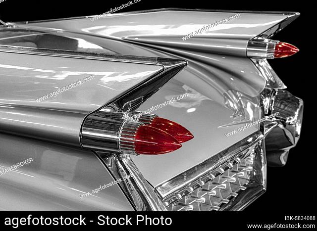 Oldtimer detail, Cadillac Sedan Deville 1959, in black and white, with red brake light