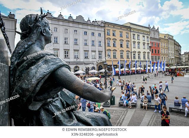 View of Main Market Square in Krak—w Old Town from perspective of Adam Mickiewicz Monument found in middle, Lesser Poland Voivodeship, Poland