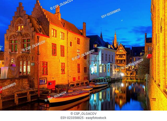 Cityscape with the picturesque night canal Dijver in Bruges