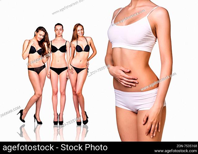 Woman shows her weight loss, isolated on white background