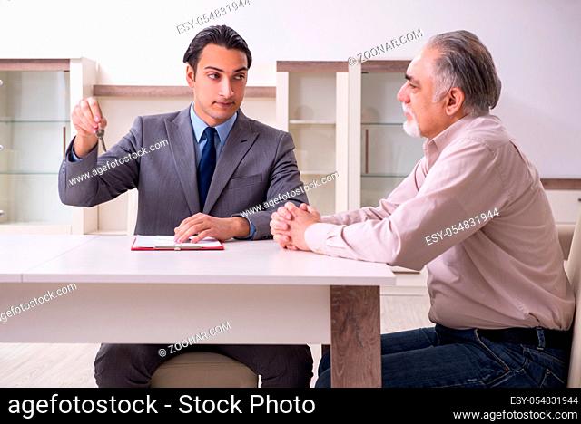 Male real estate agent and male client in the apartment