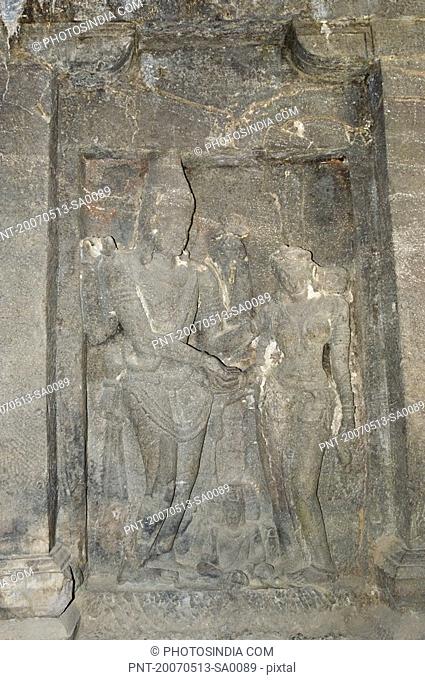Statues of Hindu god and goddess carved in a cave, Ellora, Aurangabad, Maharashtra, India