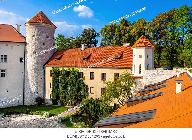 Pieskowa Skala, Lesser Poland / Poland - 2018/09/09: Inner courtyard and gothic tower of historic castle Pieskowa Skala by the Pradnik river in the Ojcowski...
