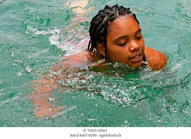School girl swimming in swimming pool, St Mark's School, Mbabane, Hhohho, Kingdom of Swaziland