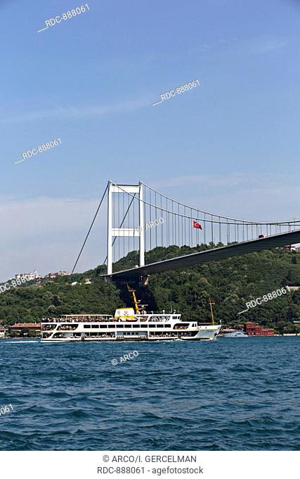 Ferry and fatih Sultan Mehmet Bridge on Bosphours, Istanbul, Turkey