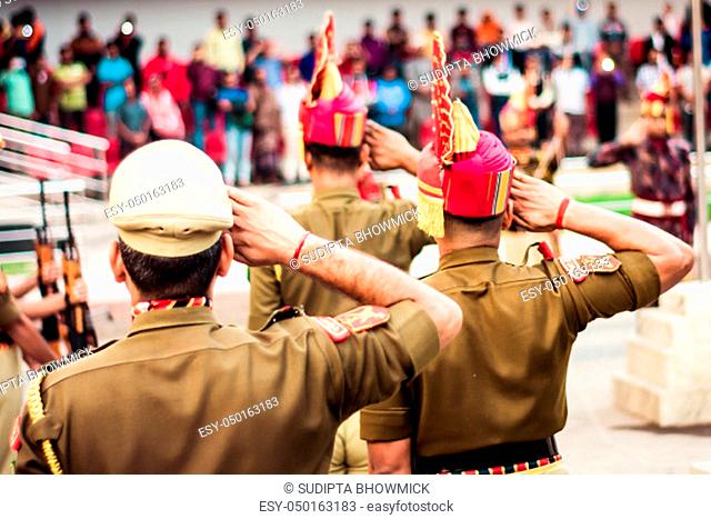 Portrait of an unrecognizable indian policeman saluting each other