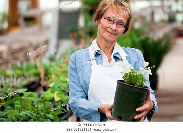 Senior Woman with Potted Plant