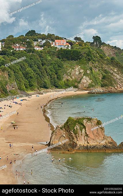 People at the beach in Tenby, an ancient walled town; now a tourist destination in the county of Pembrokeshire, south Wales, UK
