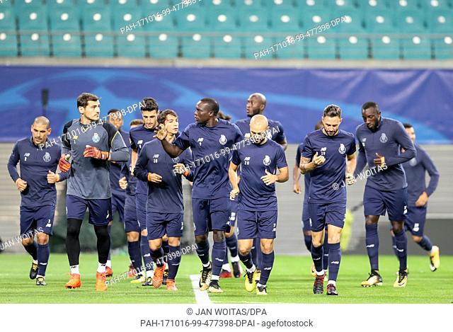 Porto's players warm up prior to their training session ahead of their UEFA Champions League match against RB Leipzig at the Red Bull Arena in Leipzig, Germany