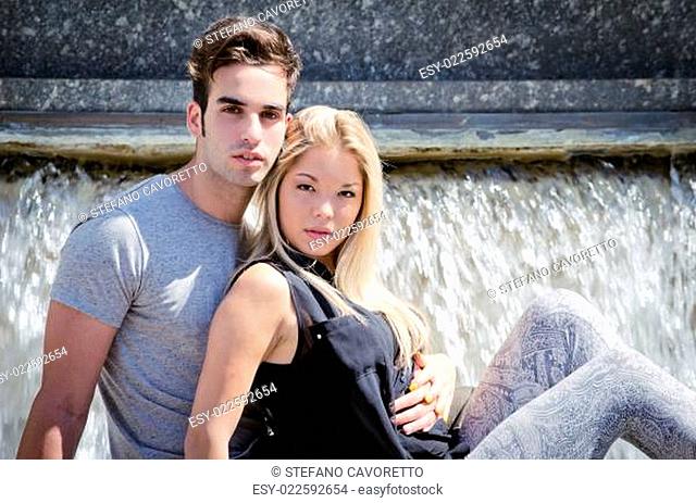 Attractive couple in front of big fountain