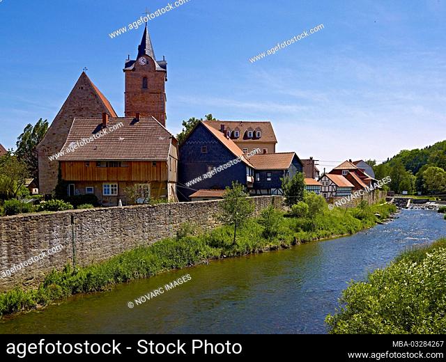Stadtkirche St. Bartholom„us with city wall and Werra in Themar, Thuringia, Germany