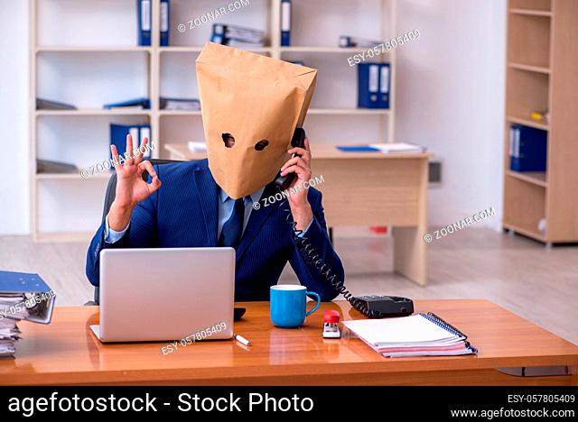 Male employee with box instead of his head