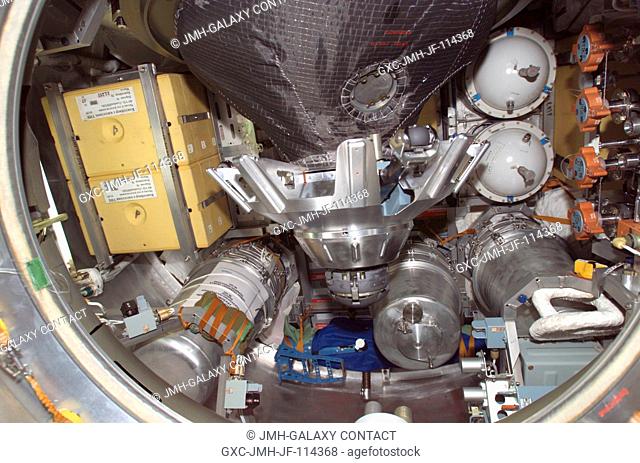 View of stowage items and the probe-and-cone docking mechanism in the hatch of the Progress 18 resupply craft, which docked to the aft port of the Zvezda...