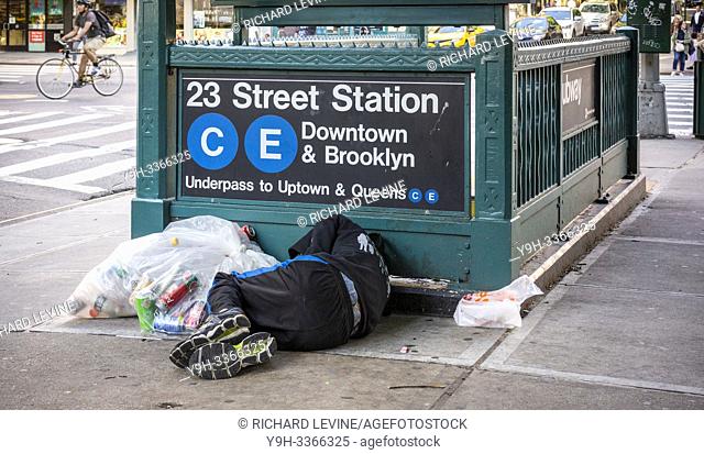 A homeless individual encamped outside a subway entrance in New York on Friday, June 14, 2019. (© Richard B. Levine)