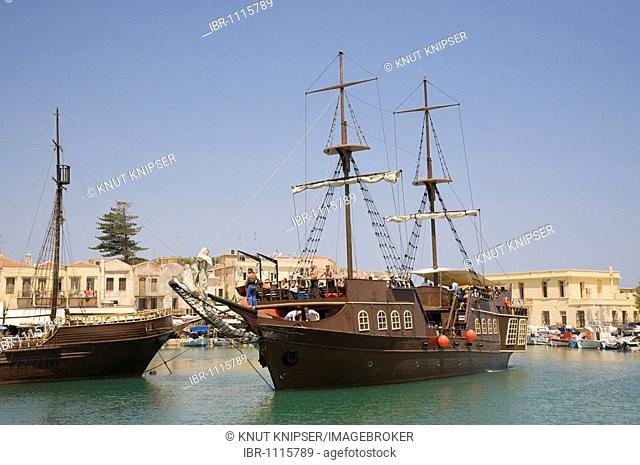 The cruise vessel Barbarossa, decorated like a pirate ship, leaves the Venetian harbor of Rethymnon, island of Crete, Greece, Europe