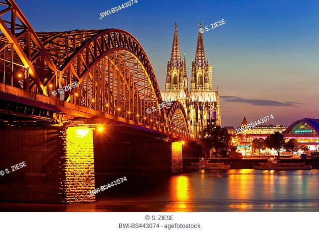 Cologne Cathedral with Hohenzollern Bridge in the twilight, Germany, North Rhine-Westphalia, Cologne