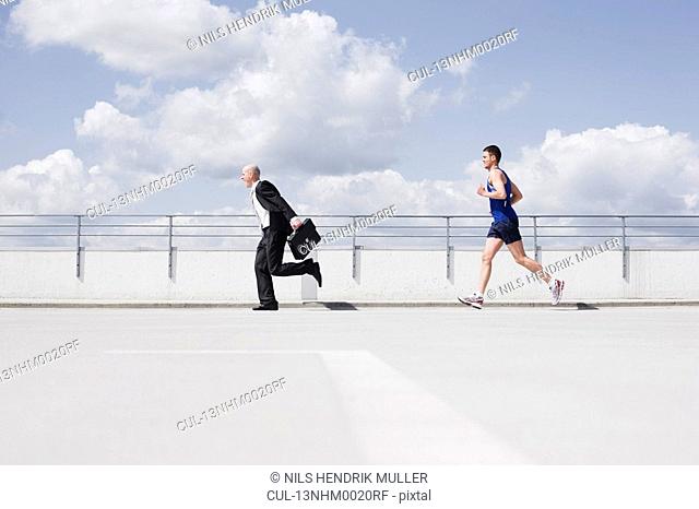 business man running from jogger