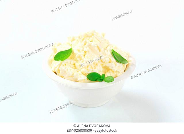 white creamy cheese in a small bowl