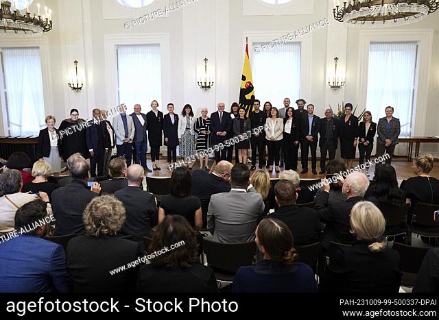 09 October 2023, Berlin: Federal President Frank-Walter Steinmeier and the recipients of the Order of Merit for the Day of German Unity stand together for a...