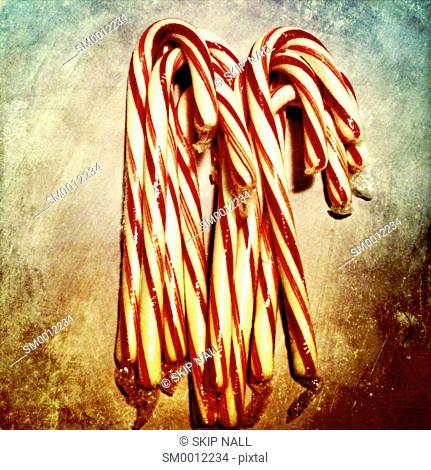 Christmas candy canes on a textured background