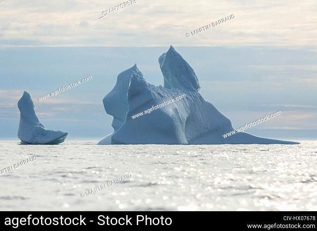 Majestic iceberg formations on sunny Atlantic Ocean Greenland