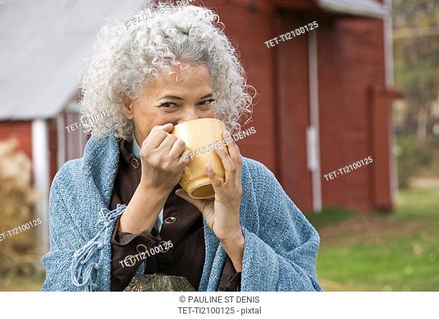 Woman drinking from mug