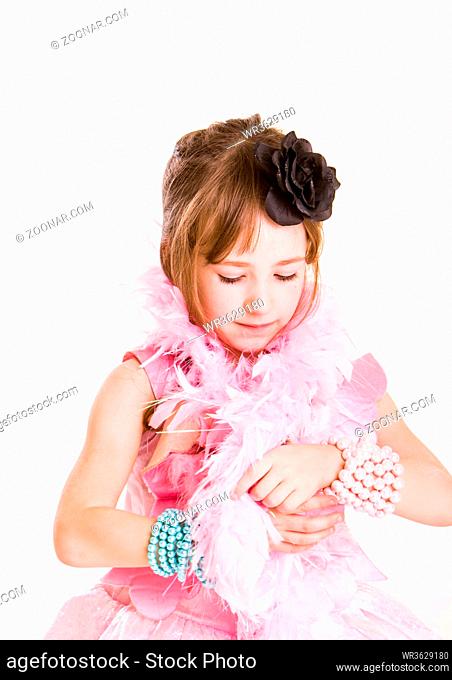 little girl playing princess or ballerina in a pink costume