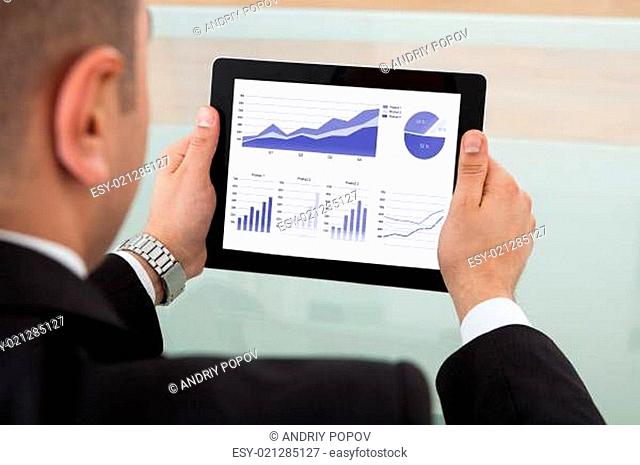 Businessman Checking The Stock Market On Digital Tablet
