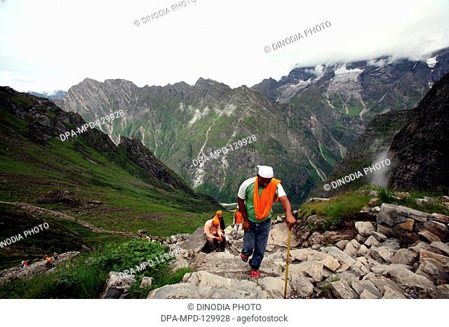 Devotees going to Sikhs shrine Shri Hemkund Sahib situated (4320 meters high) at Govind ghat which is the gateway to the Bhvundar or Lakshman Ganga valley ;...