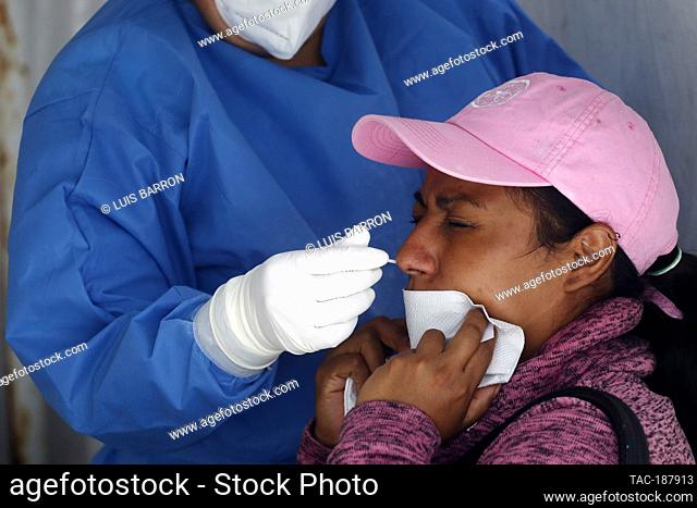 MEXICO CITY, MEXICO - AUGUST 10: A woman undergoes a rapid test in a Health Kiosk, to detect Sars Cov-2 that causes Covid-19 disease