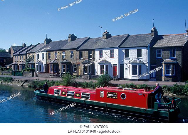 River Isis. Canal boat, narrow boat. Terraced houses