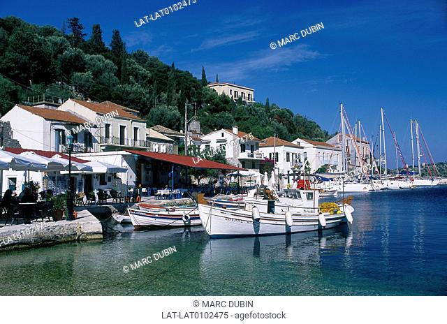 Ionian island. Town, port. Harbour. Boats, yachts moored. Quake-free