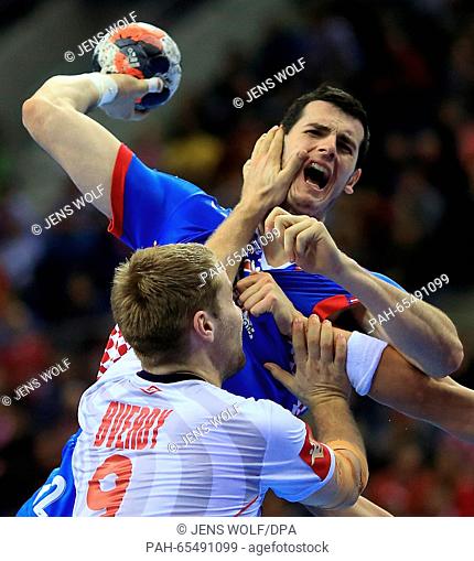 Croatia's Ivan Sliskovic (back) in action against Norway's Petter Overby during the 2016 European Men's Handball Championship third-place game between Norway...