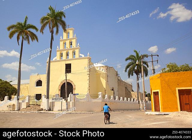 Cyclist in front of the Church Of The Immaculate Conception at the town center, Chumayel, Convent Route, Yucatan Province, Mexico, Central America