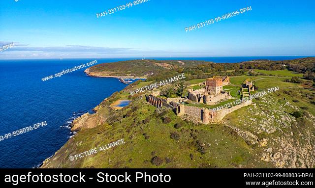 23 October 2023, Denmark, Vang: View of the ruins of the medieval fortress Hammershus on the northwestern tip of the Danish island in the Baltic Sea (aerial...