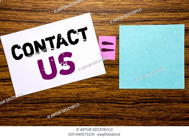 Handwriting Announcement text showing Contact Us. Business concept for Customer Support written on sticky note paper wooden background