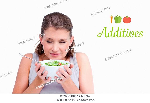 Additives against woman smelling a salad